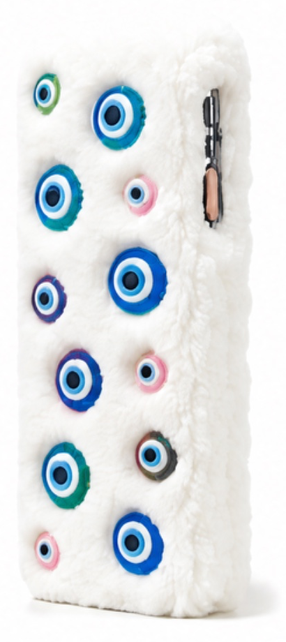 White fluffy case with blue, teal and pink evil-eye charms